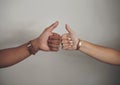 Our love is on the right track. Cropped shot of an unrecognizable couple standing together against a grey wall indoors Royalty Free Stock Photo