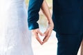 Shes made me her better half. Cropped shot of an unrecognizable newlywed couple making a heart shape with their hands Royalty Free Stock Photo