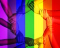 This is a discrimination free zone. Cropped shot of unrecognizable people linking arms against a multi colored overlay.