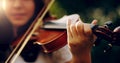 Music lifts the spirit and enlightens the soul. Cropped shot of an unrecognizable teenage girl playing a violin outside. Royalty Free Stock Photo