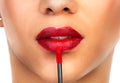 Put on some red lipstick and live a little. Cropped shot of an unrecognizable woman applying red lipstick to her lips. Royalty Free Stock Photo