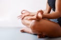 A yoga session might just be what you need. Cropped shot of an unrecognizable woman practising yoga against a white