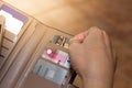 Cropped shot view of female hands picking credit cards from her wallet Royalty Free Stock Photo