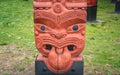 The cropped shot view of the traditional Maori wood carving statue. Royalty Free Stock Photo