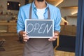 cropped shot of waiter in apron holding Royalty Free Stock Photo