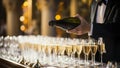 cropped shot of waiter holding bottle of champagne in restaurant during party