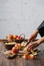 cropped shot of woman cutting apples on wooden Royalty Free Stock Photo