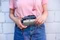 cropped shot of woman with earphones holding retro cassette player in hands against white Royalty Free Stock Photo