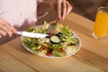 Woman eating fresh salad