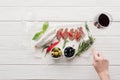 Cropped shot of woman, glass of red wine and meat snacks Royalty Free Stock Photo