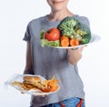 cropped shot of woman holding plates with vegetables Royalty Free Stock Photo