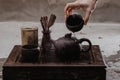 Cropped shot of woman pouring tea in traditional chinese teaware Royalty Free Stock Photo