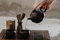 Cropped shot of woman pouring tea in traditional chinese teaware Royalty Free Stock Photo