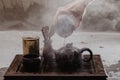 Cropped shot of woman pouring tea in traditional chinese teaware Royalty Free Stock Photo