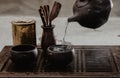 Cropped shot of woman pouring tea in traditional chinese teaware Royalty Free Stock Photo