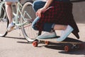 cropped shot of woman riding bicycle and towing her female friend