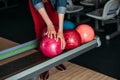 cropped shot of woman taking bowling ball Royalty Free Stock Photo