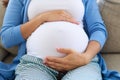 Woman in third trimester touches her belly Royalty Free Stock Photo