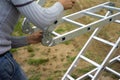 Worker arranging expandable ladder