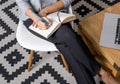 Cropped shot of young businesswoman writing notes