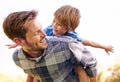 He loves his little boy so much. Cropped shot of a young father giving his son a piggyback ride. Royalty Free Stock Photo