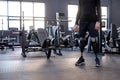 cropped shot of a young man with an artificial legs standing confidently at gym. Royalty Free Stock Photo