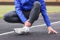 Cropped shot of a young man holding his ankle in pain sprain a f Royalty Free Stock Photo