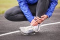 Cropped shot of a young man holding his ankle in pain sprain a f Royalty Free Stock Photo