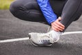 Cropped shot of a young man holding his ankle in pain sprain a f Royalty Free Stock Photo