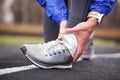 Cropped shot of a young man holding his ankle in pain sprain a f