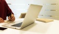 Cropped shot of a young man working from home using laptop Royalty Free Stock Photo