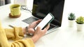 Cropped shot of young woman hands busy using cell phone with empty screen. Royalty Free Stock Photo