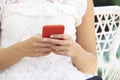 Cropped shot of young woman`s hand with her mobile phone Royalty Free Stock Photo