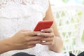 Cropped shot of young woman`s hand with her mobile phone Royalty Free Stock Photo
