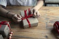 Young woman wrapping presents for Christmas. Royalty Free Stock Photo