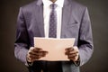 Cropped silhoouette of black man in trendy suit with a lot of office paper