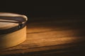 Cropped stick on bodhran over wooden table Royalty Free Stock Photo