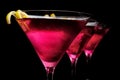 Cropped three cosmopolitan cocktails in line on black Royalty Free Stock Photo