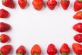 Cropped top above overhead view photo of strawberries lined up on the sides making center empty on white background