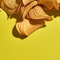 Cropped top view of heap of delicious potato chips