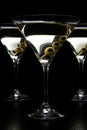 Cropped Vermouth Martini drinks with olives isolated on black Royalty Free Stock Photo