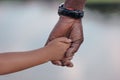 cropped view of african american grandfather holding hands