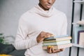 Cropped view of african american woman holding books Royalty Free Stock Photo