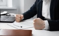 Cropped view Angry businessman with closed fists on the table