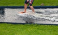 Cropped view of barefoot male surfing in pool Royalty Free Stock Photo