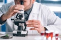 cropped view of bearded biochemist looking Royalty Free Stock Photo