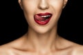 cropped view of beautiful woman licking lips with red lipstick Royalty Free Stock Photo