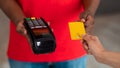 Cropped view of black man holding POS machine for payment Royalty Free Stock Photo