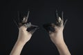 Cropped view of black painted hands Royalty Free Stock Photo