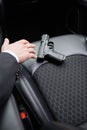 cropped view of bodyguard reaching gun Royalty Free Stock Photo